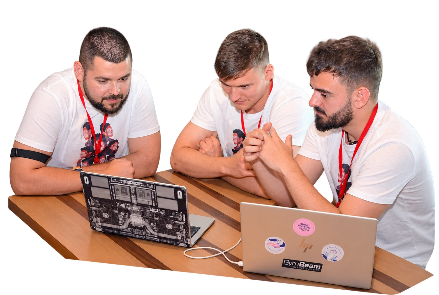 Three June Hack A Ton participants working together around their laptops